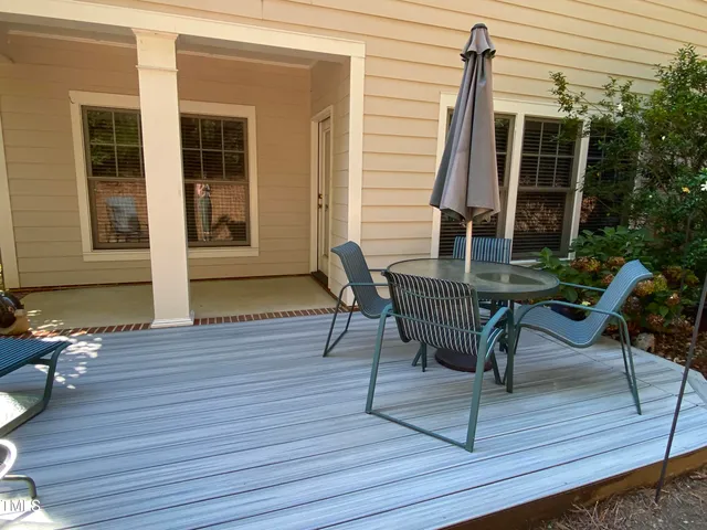 a sign that is sitting in front of flowers