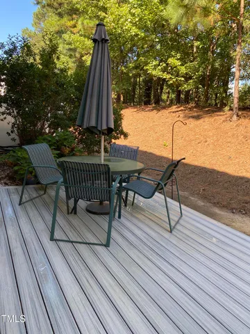 a view of outdoor space with swimming pool and sitting area