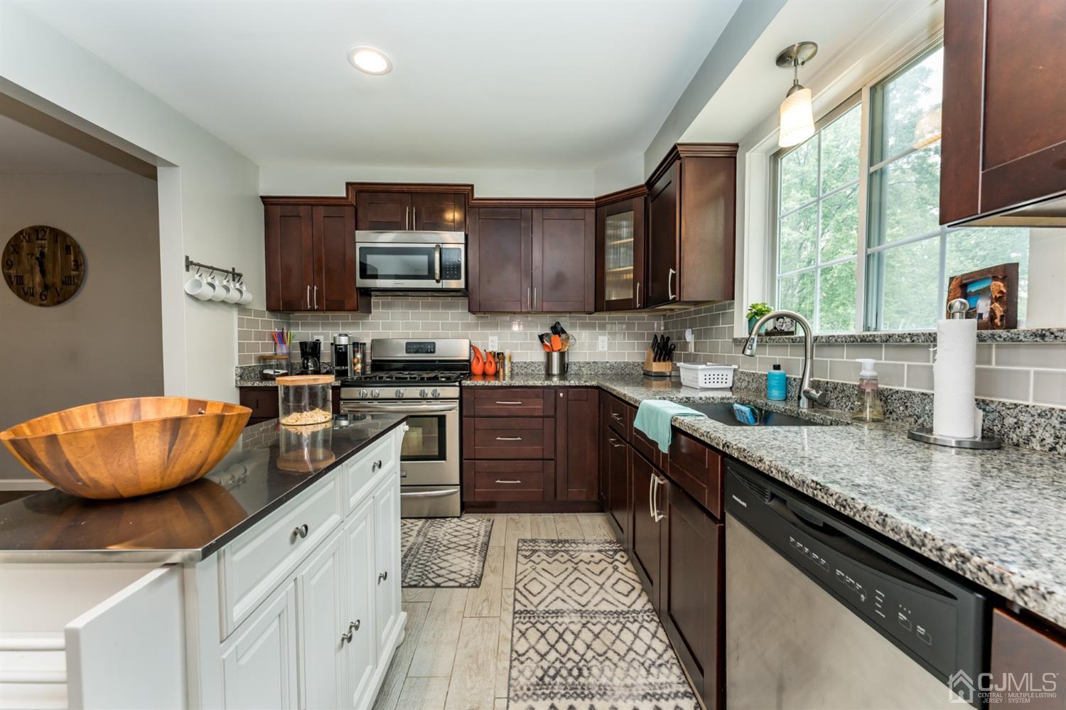 1077 Cranbrook Road Union, NJ 07083 - Photo 13 of 37 a kitchen with a sink a stove and cabinets