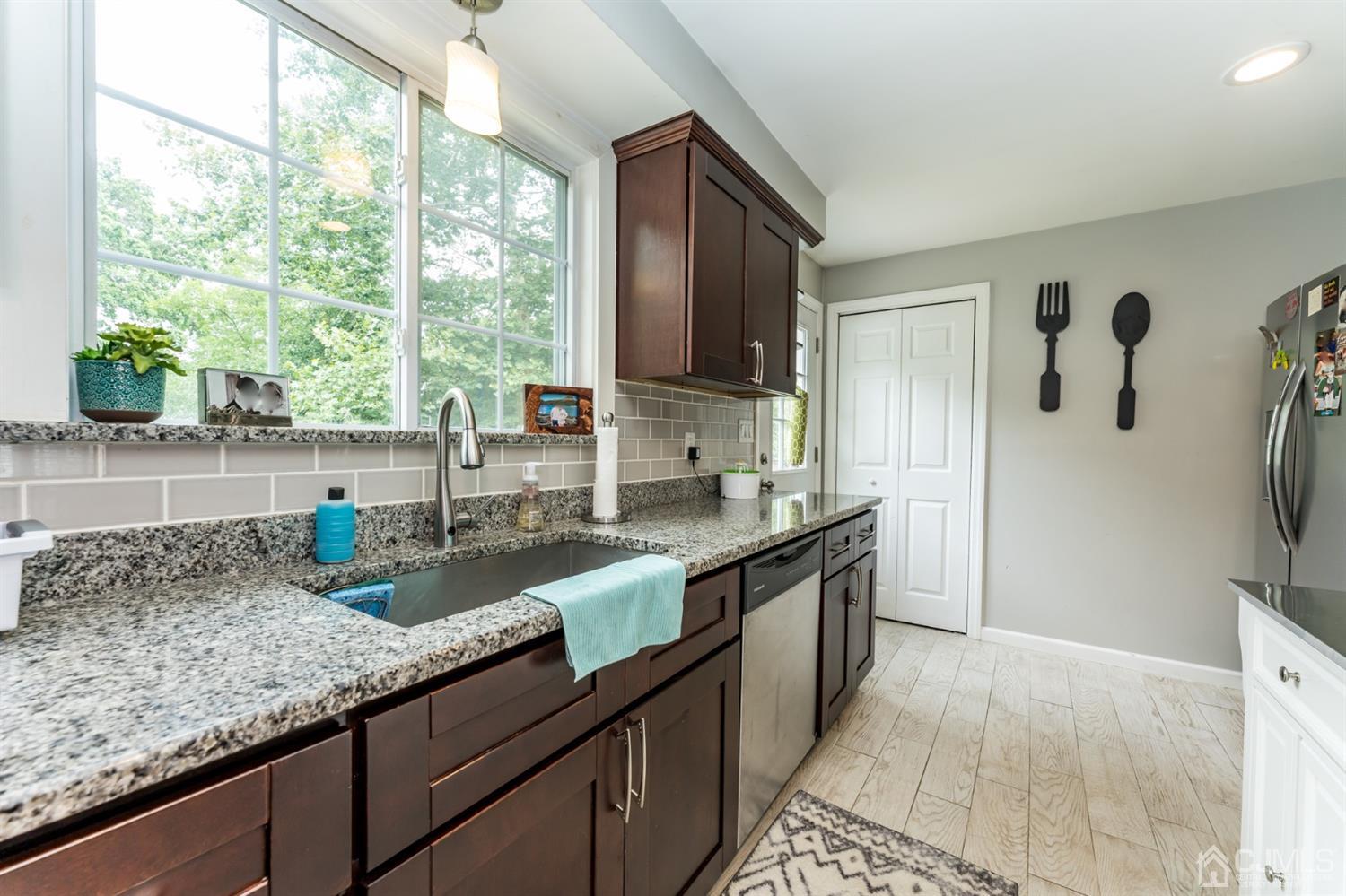 1077 Cranbrook Road Union, NJ 07083 - Photo 17 of 37 a kitchen with sink a window and cabinets