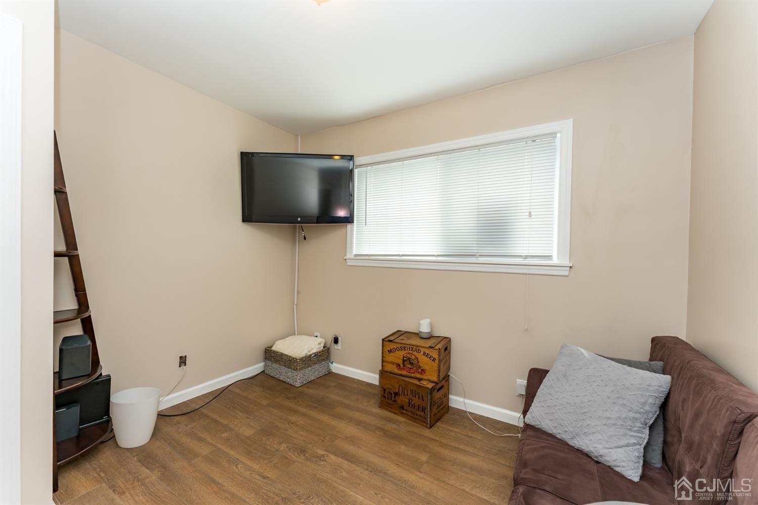 1077 Cranbrook Road Union, NJ 07083 - Photo 18 of 37 a living room with furniture and a flat screen tv