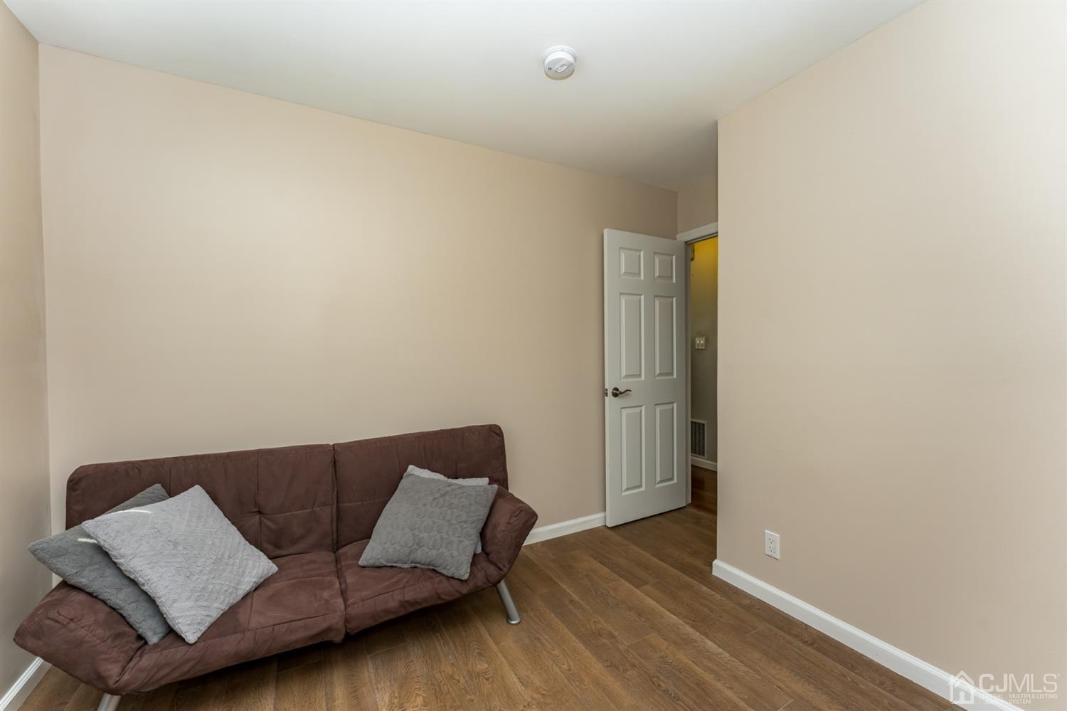 1077 Cranbrook Road Union, NJ 07083 - Photo 19 of 37 a living room with furniture and a wooden floor