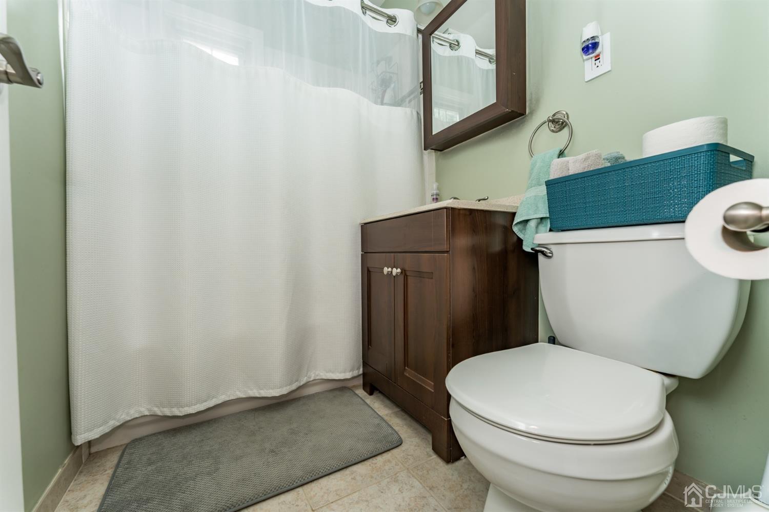 1077 Cranbrook Road Union, NJ 07083 - Photo 20 of 37 a white toilet sitting next to a bathroom sink
