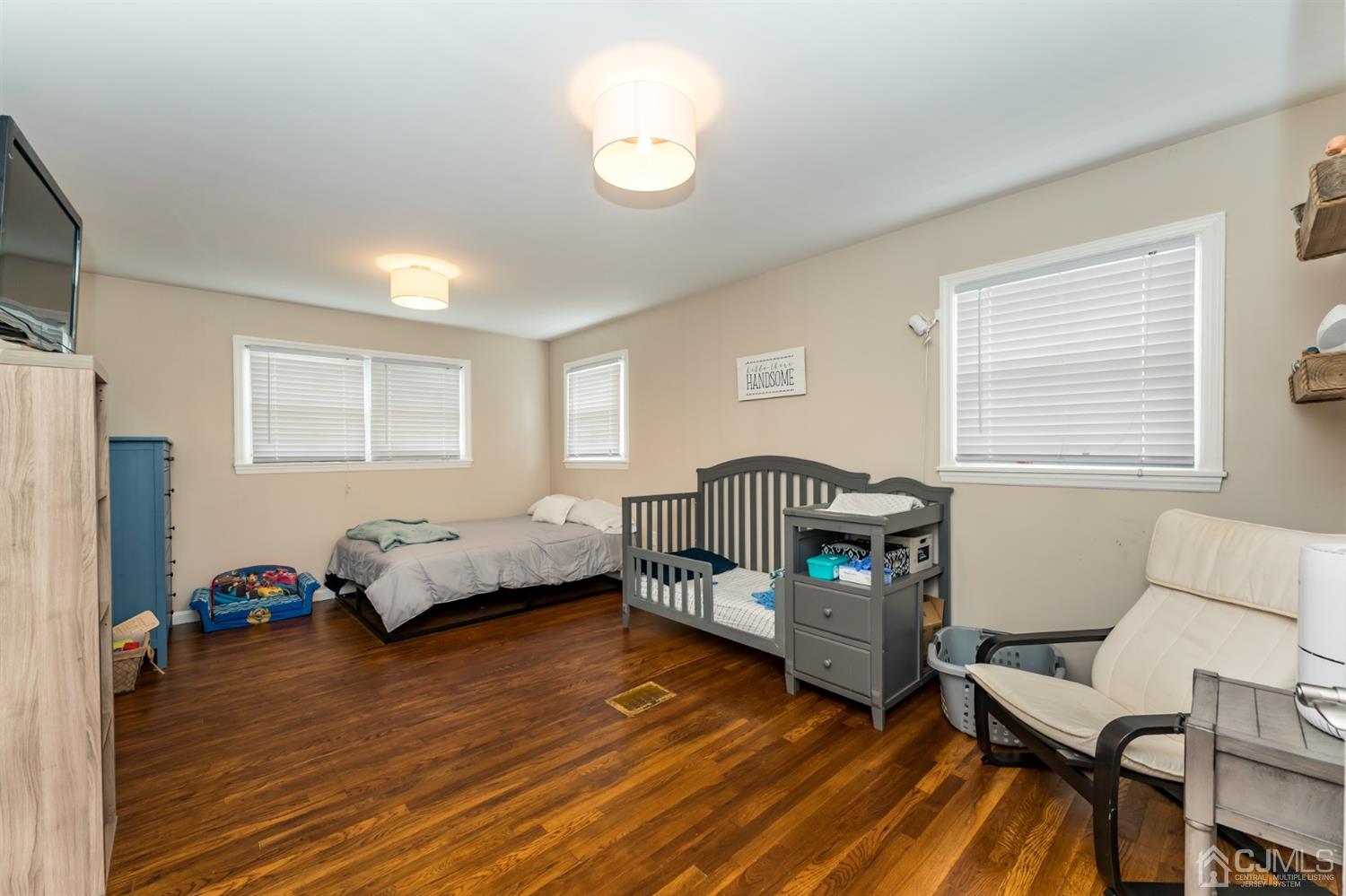 1077 Cranbrook Road Union, NJ 07083 - Photo 21 of 37 a bedroom with a bed and a window