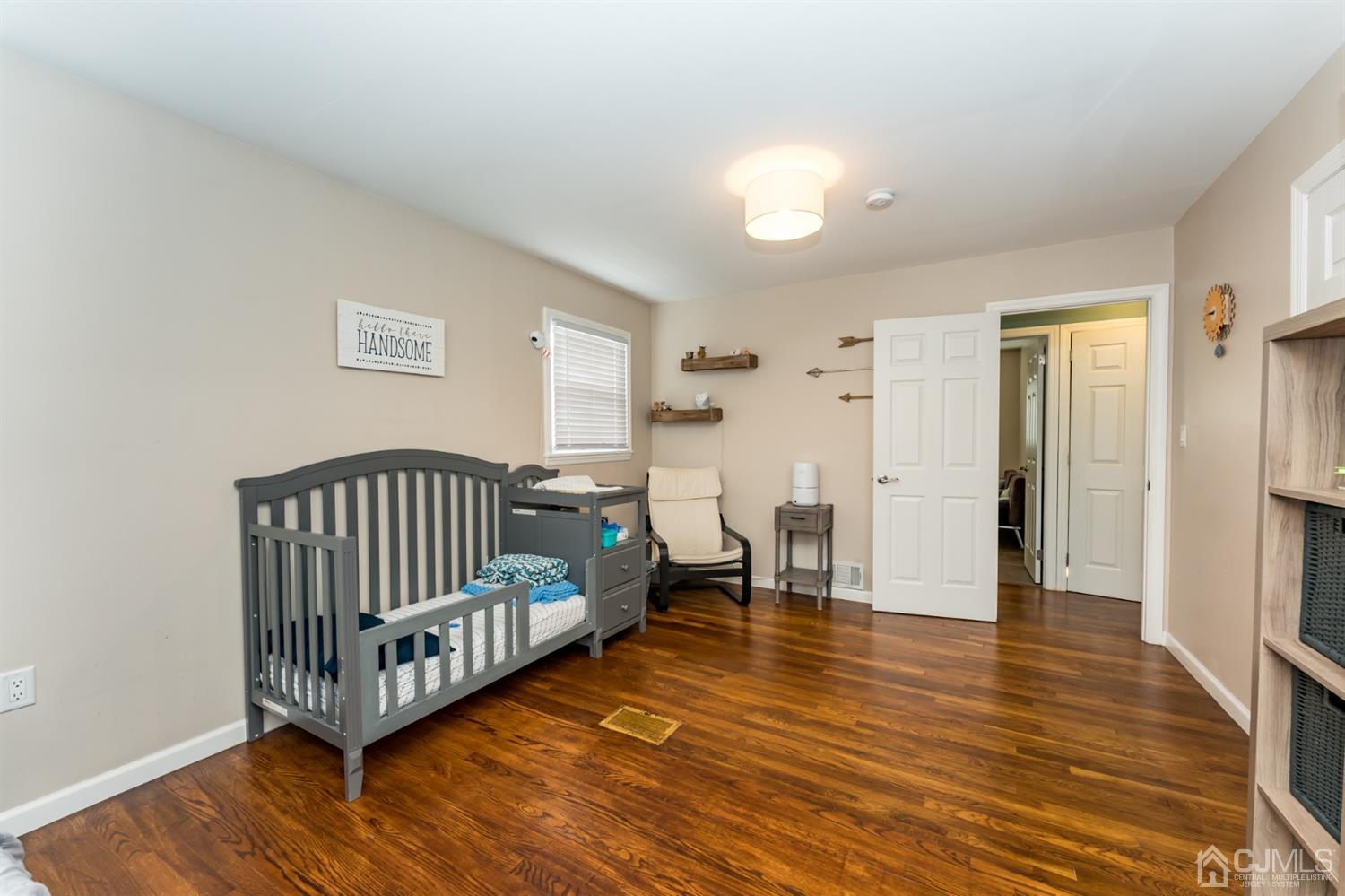 1077 Cranbrook Road Union, NJ 07083 - Photo 22 of 37 a view of a room with wooden floor and windows