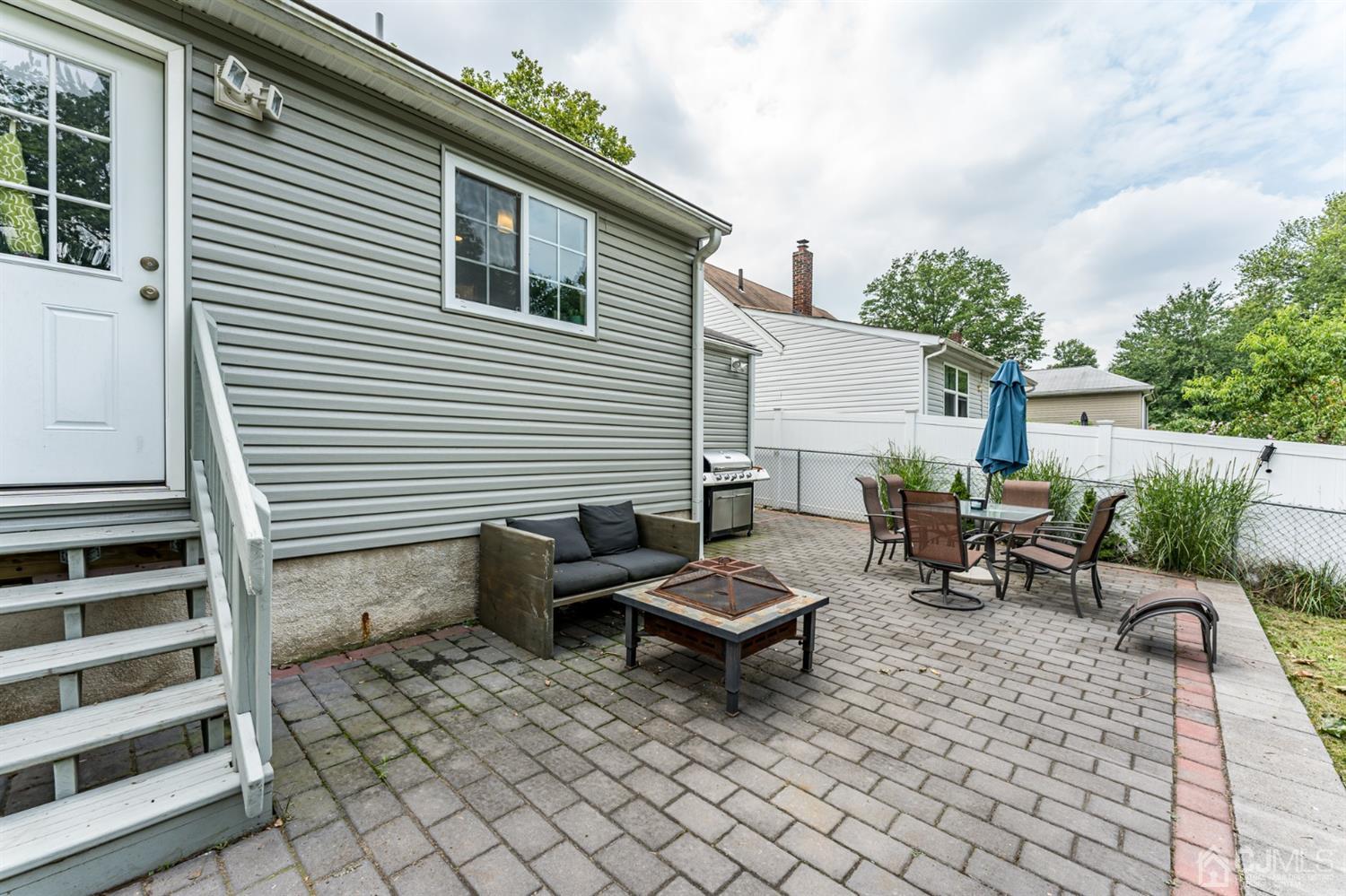 1077 Cranbrook Road Union, NJ 07083 - Photo 31 of 37 a backyard of a house with fire pit and couch