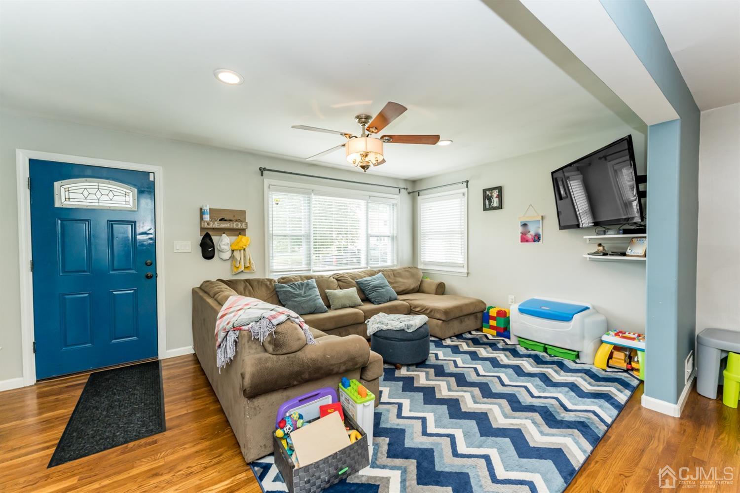 1077 Cranbrook Road Union, NJ 07083 - Photo 5 of 37 a living room with furniture and a flat screen tv