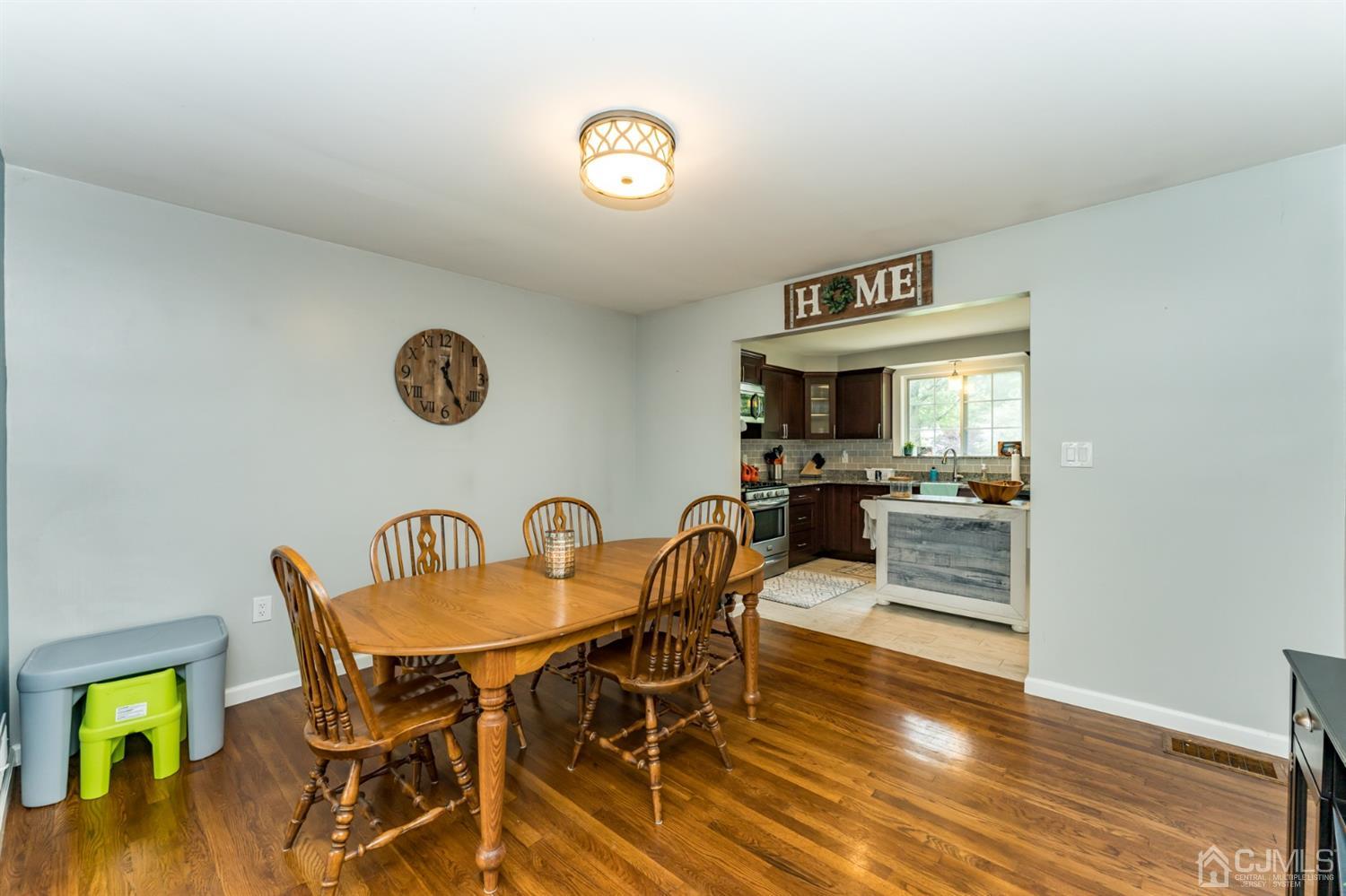 1077 Cranbrook Road Union, NJ 07083 - Photo 8 of 37 a dining room with furniture and wooden floor