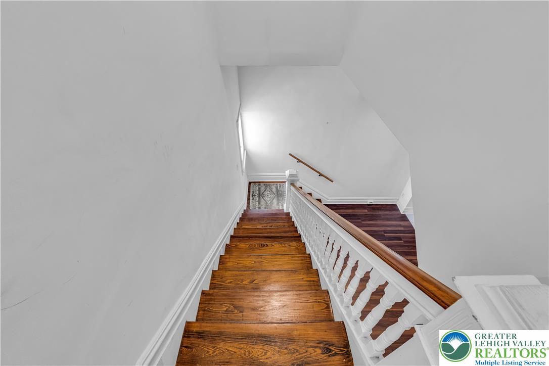 420 2nd Avenue Bethlehem, PA 18018 - Photo 11 of 34 a view of a hallway with wooden floor and white walls