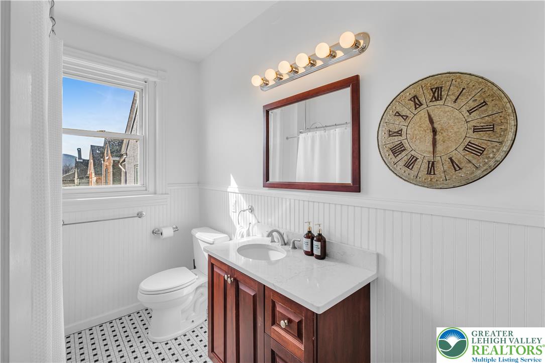 420 2nd Avenue Bethlehem, PA 18018 - Photo 15 of 34 a bathroom with a toilet a sink and a mirror