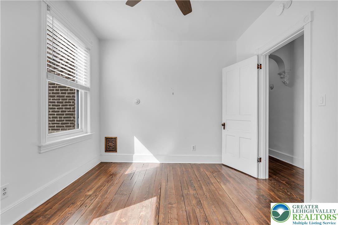 420 2nd Avenue Bethlehem, PA 18018 - Photo 19 of 34 an empty room with wooden floor and windows