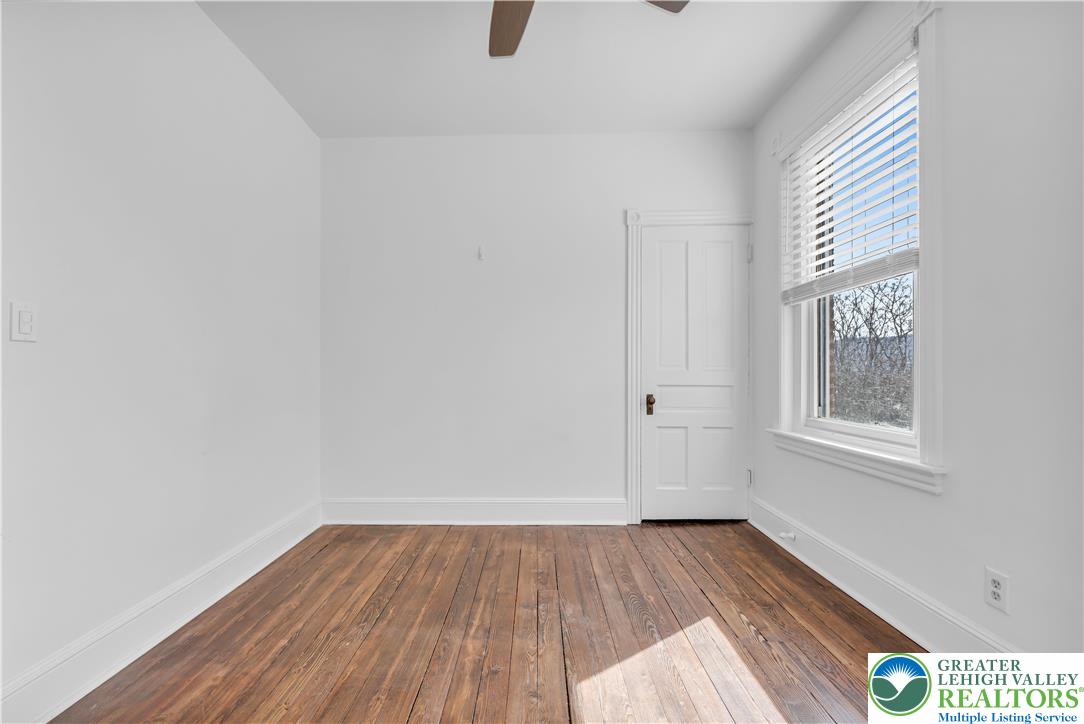 420 2nd Avenue Bethlehem, PA 18018 - Photo 20 of 34 an empty room with wooden floor and windows