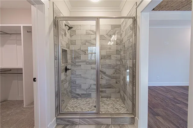 a view of a walk in closet and bedroom