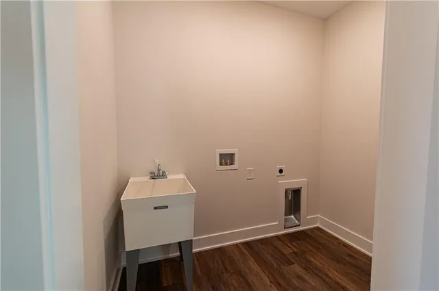 a view of a room with wooden floor
