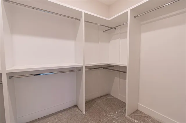 a view of an empty room with wooden walls