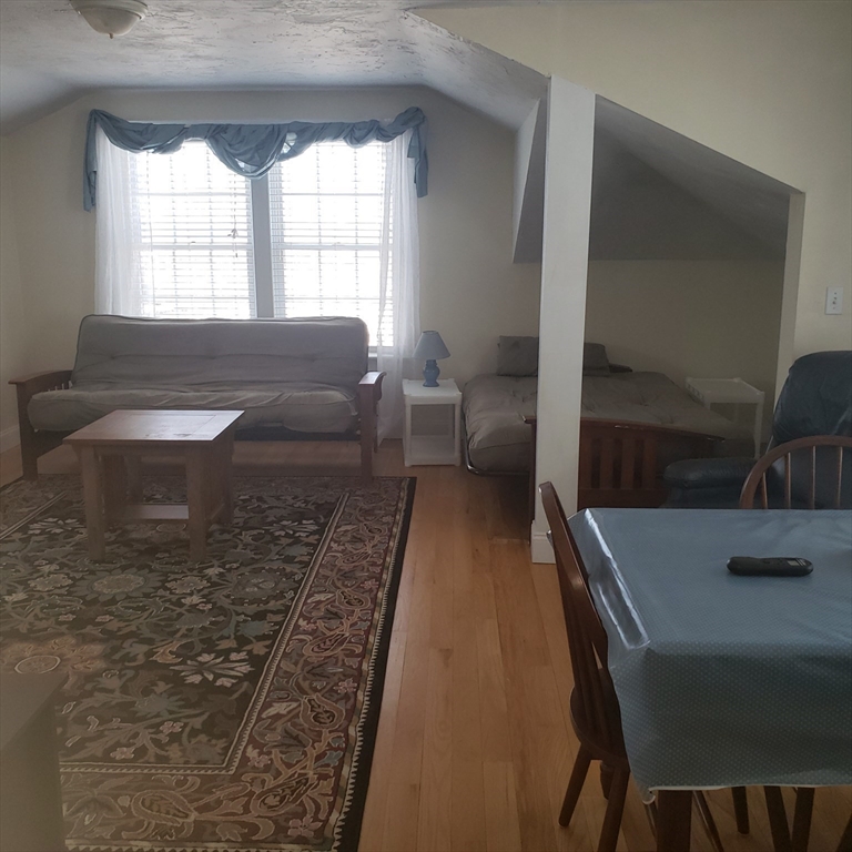 398 North End, Unit B Salisbury, MA 01952 - Photo 4 of 13 a living room with furniture and a window