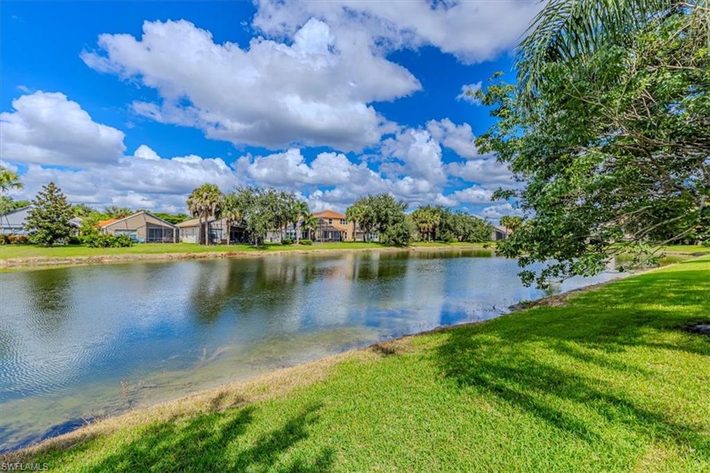 1630 Triangle Palm Terrace Naples, FL 34119 - Photo 3 of 24 a view of a lake with a city