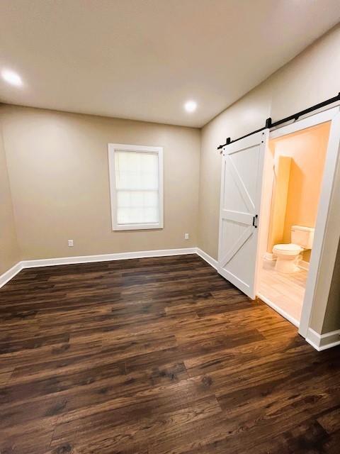 1115 Boulevard, Unit MAIN Macon, GA 31211 - Photo 3 of 9 an empty room with wooden floor and windows with curtains
