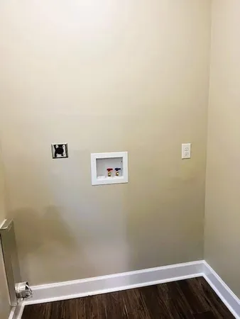 an empty room with wooden floor