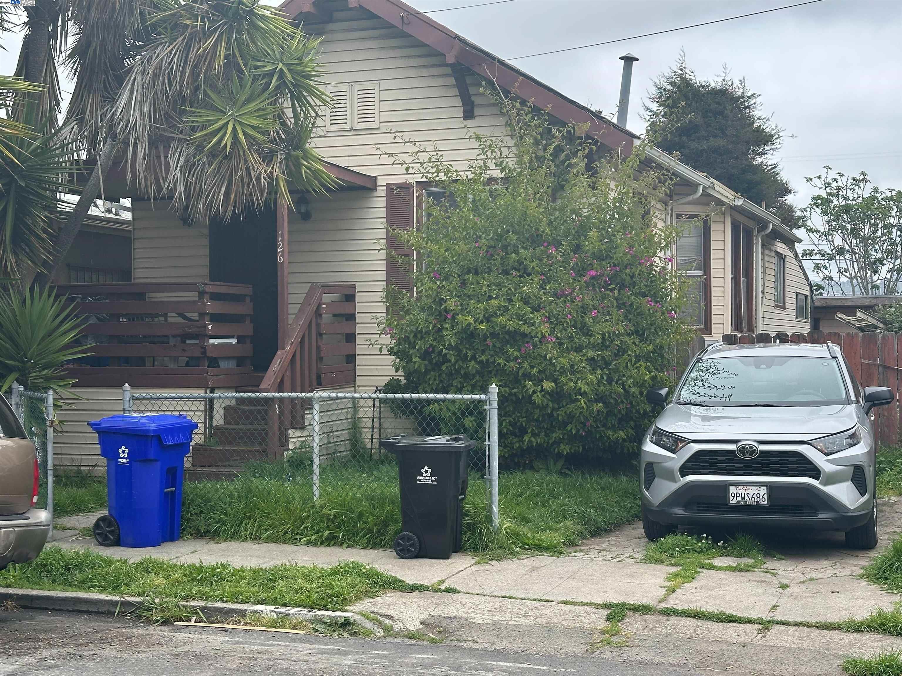 a car parked in front of a house
