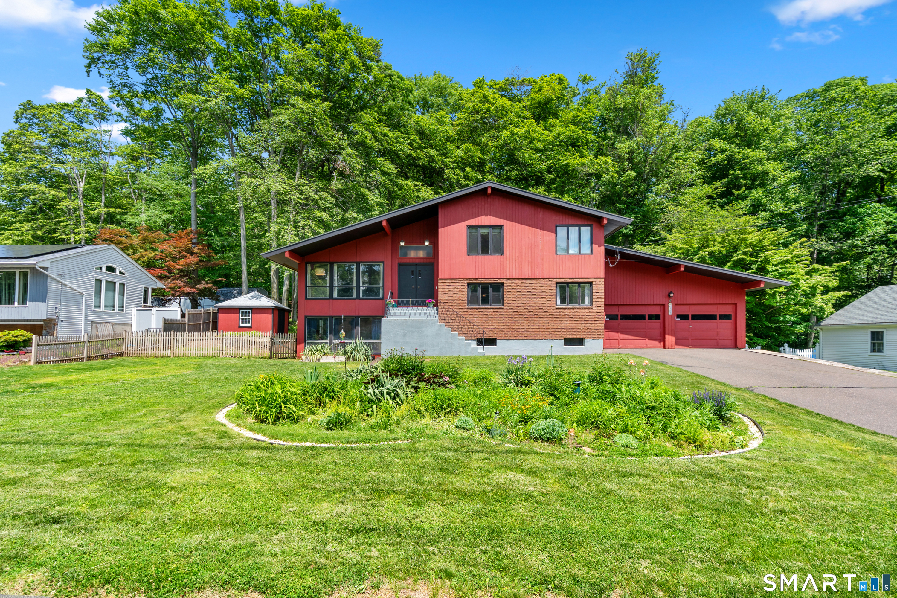 107 Round Hill Road Wethersfield, CT 06109 - Photo 2 of 40 a house view with a garden space