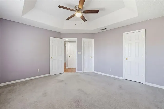 a living room with furniture cabinets and window