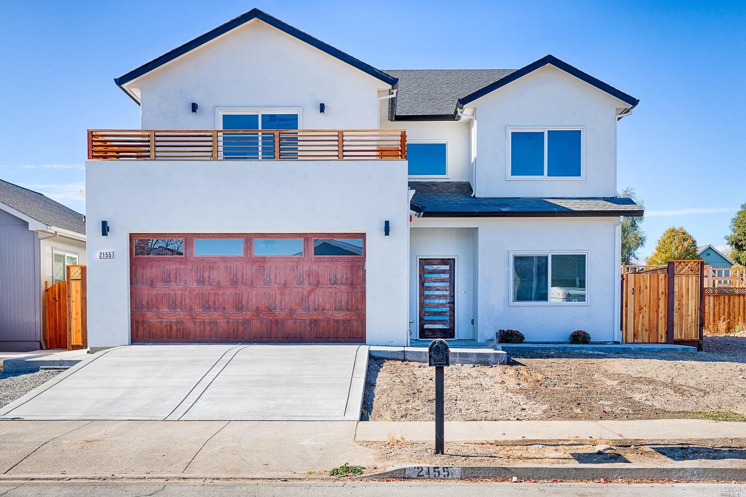 2155 Frida Street Santa Rosa, CA 95403 - Photo 1 of 1 a front view of a house with a yard and garage