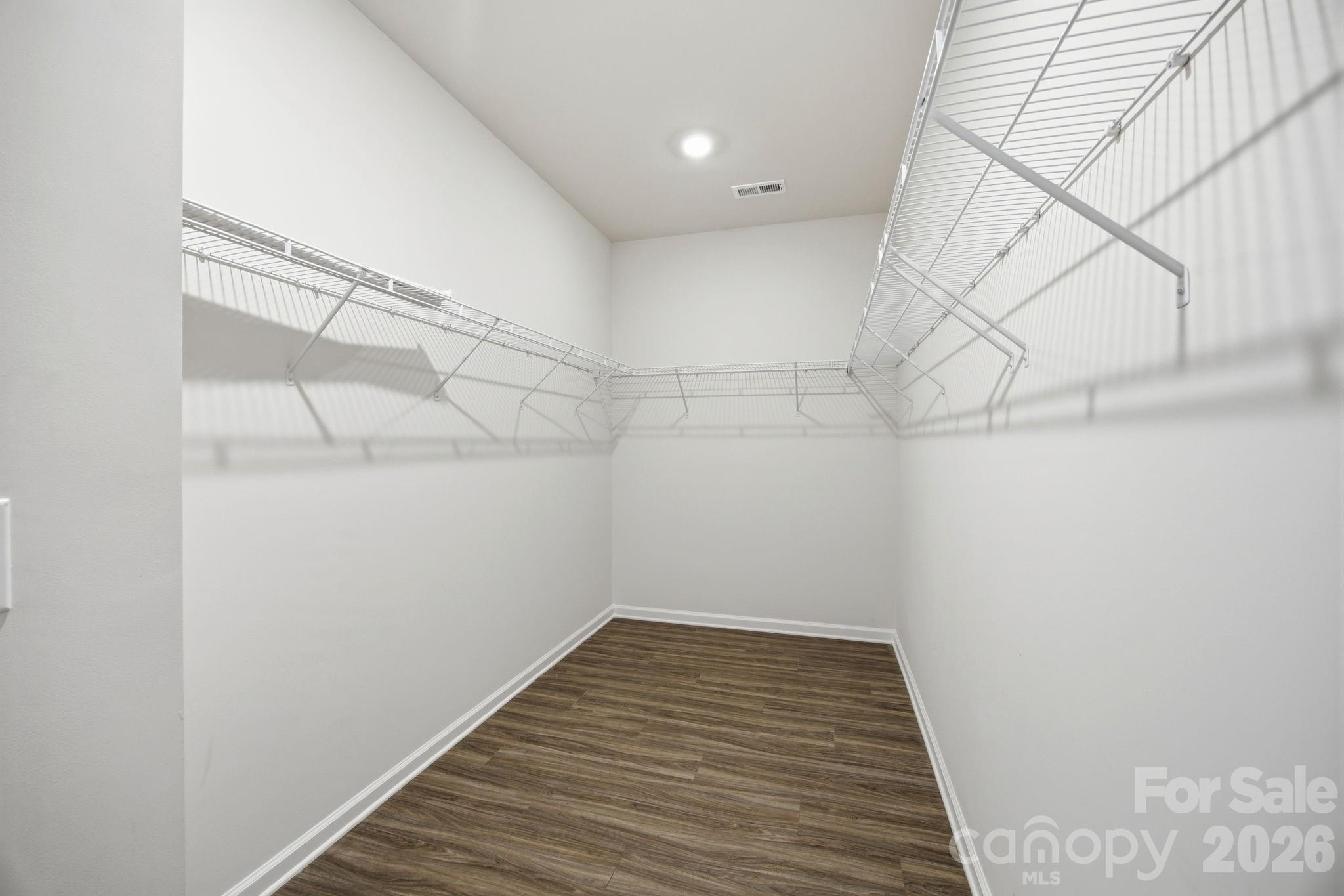 234 Hamptons Cove Road Troutman, NC 28166 - Photo 15 of 32 a view of a room with racks on the wall