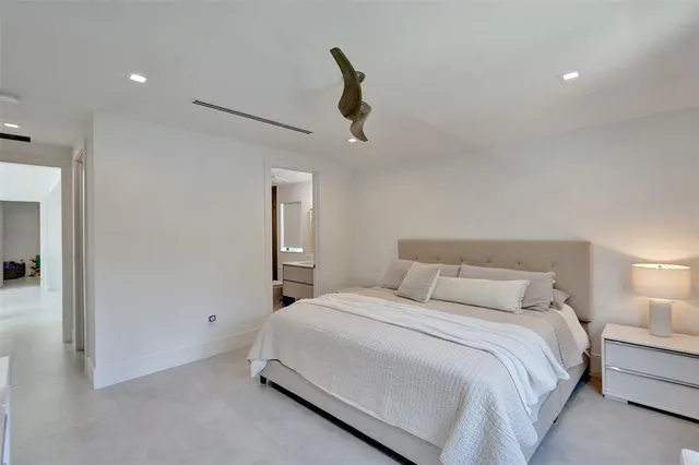 a view of parking garage with cars parked