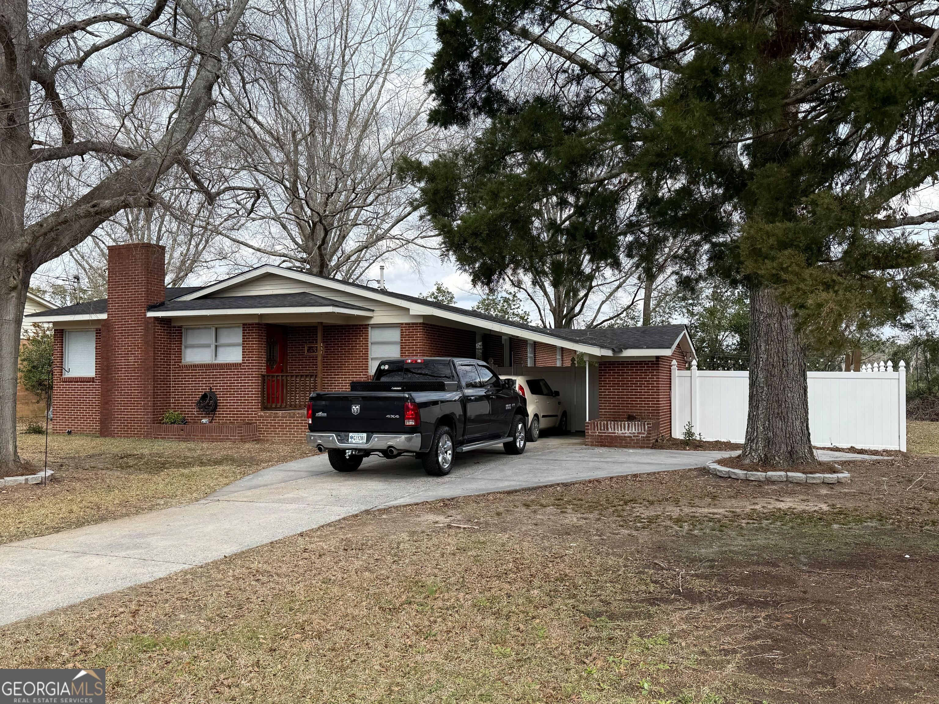 804 Betty Street Sandersville, GA 31082 - Photo 1 of 21 a view of a car in front of house
