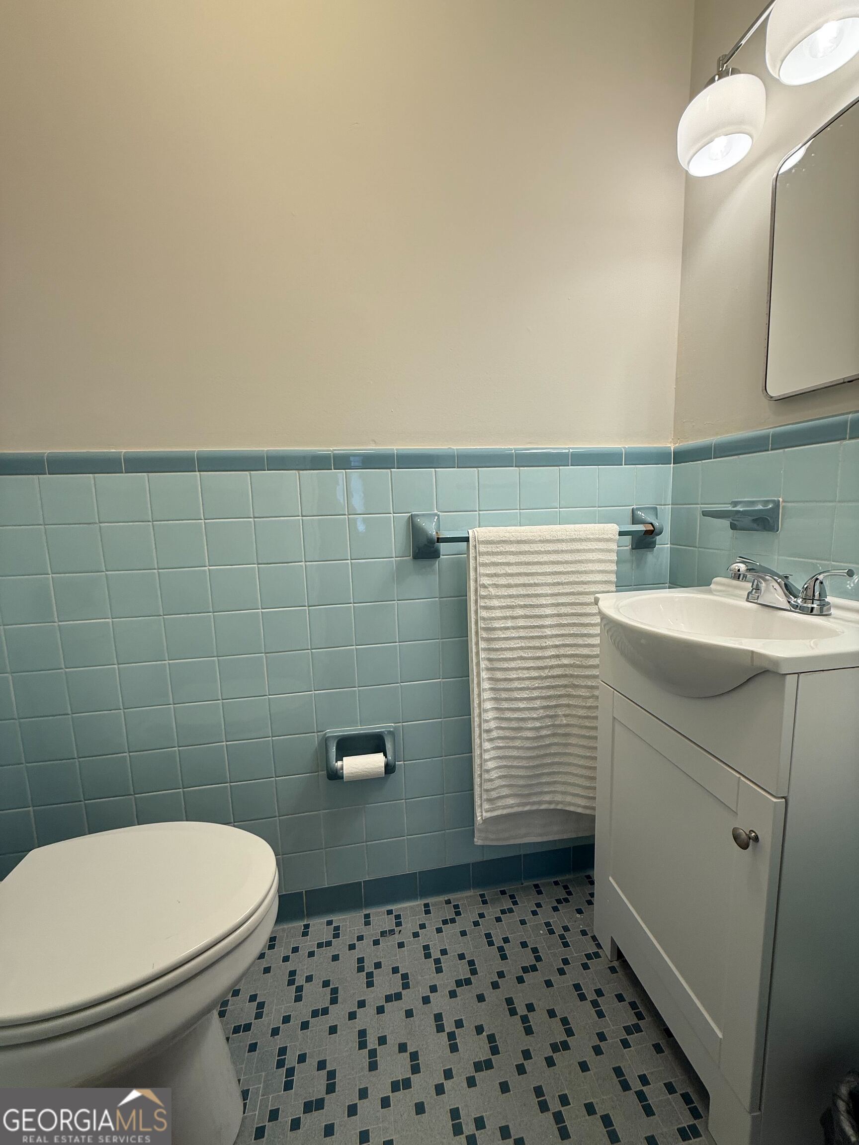 804 Betty Street Sandersville, GA 31082 - Photo 11 of 21 a bathroom with a toilet and a sink