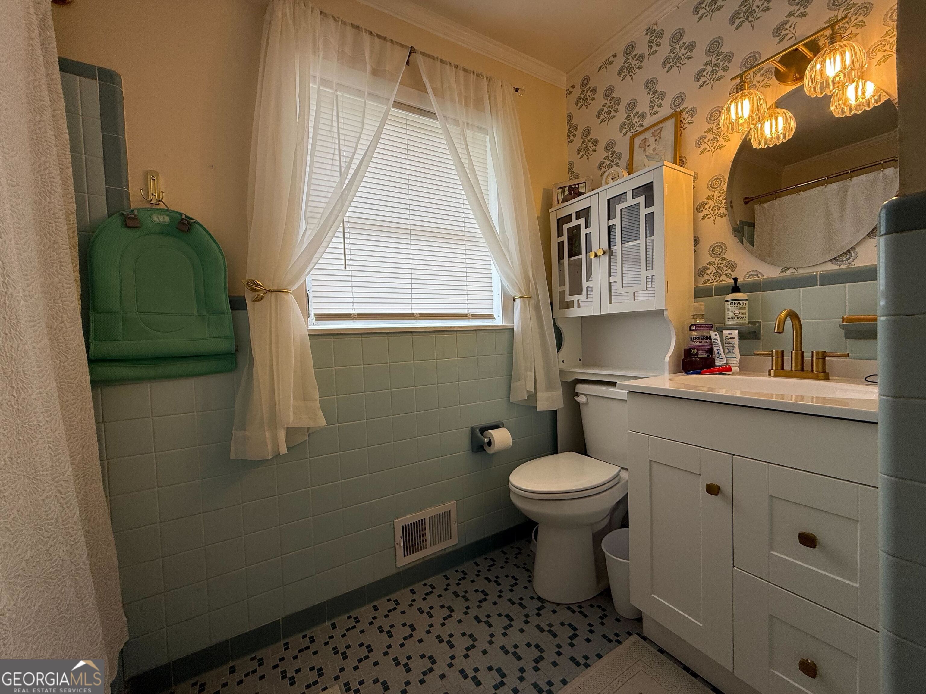 804 Betty Street Sandersville, GA 31082 - Photo 13 of 21 a bathroom with a sink toilet and a mirror