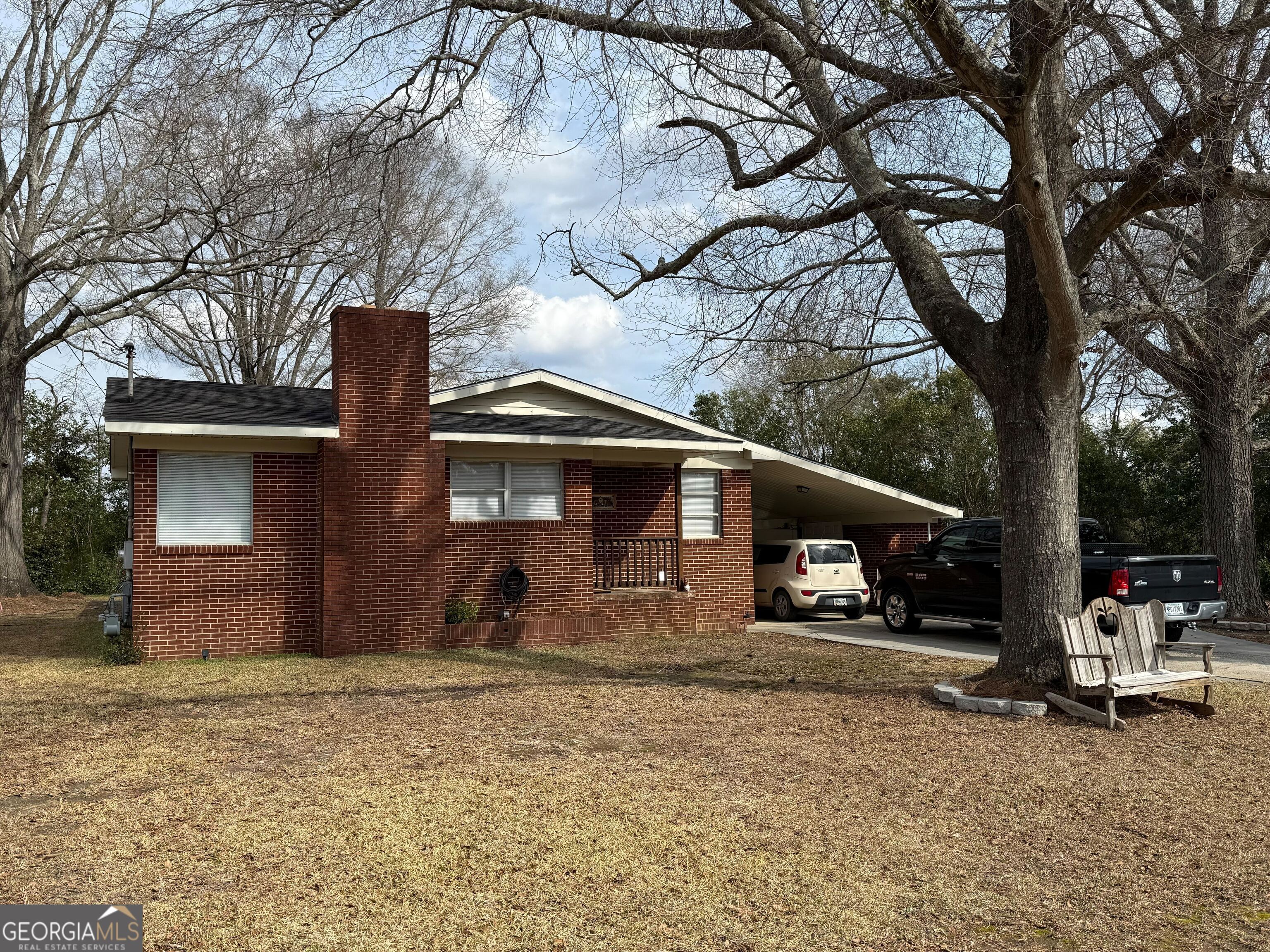804 Betty Street Sandersville, GA 31082 - Photo 2 of 21 a front view of a house with garden