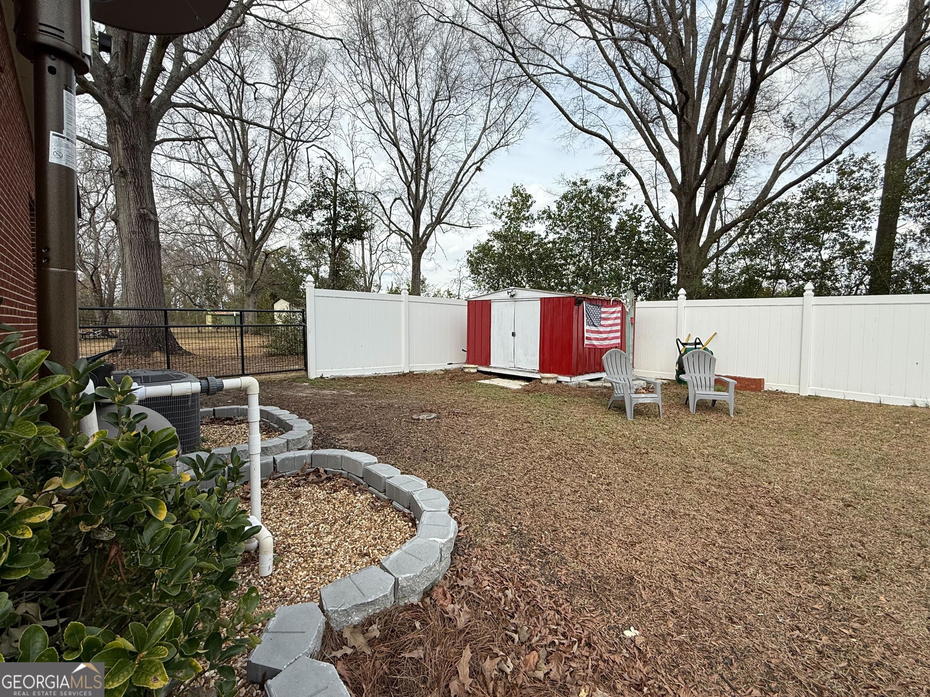 804 Betty Street Sandersville, GA 31082 - Photo 21 of 21 a view of backyard of house with green space