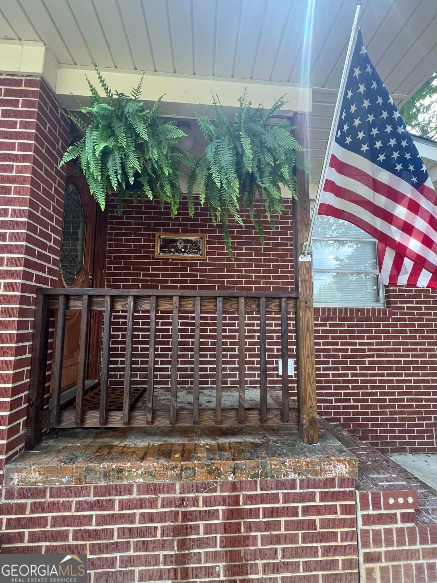 804 Betty Street Sandersville, GA 31082 - Photo 5 of 21 a view of a brick house with an outdoor space