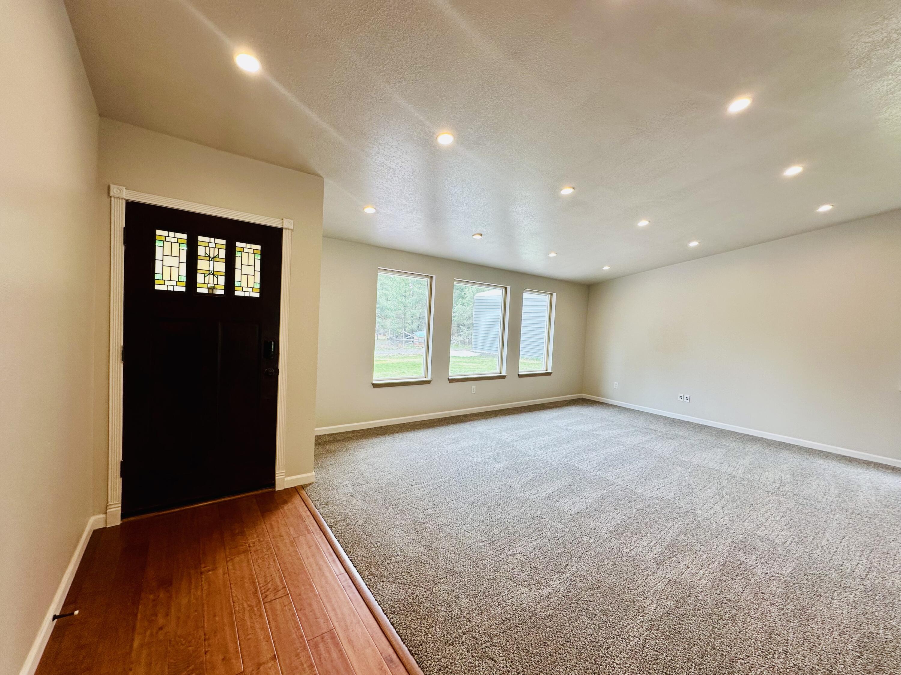 16524 Fieldcrest Road Klamath Falls, OR 97603 - Photo 13 of 58 a view of an empty room with window and wooden floor