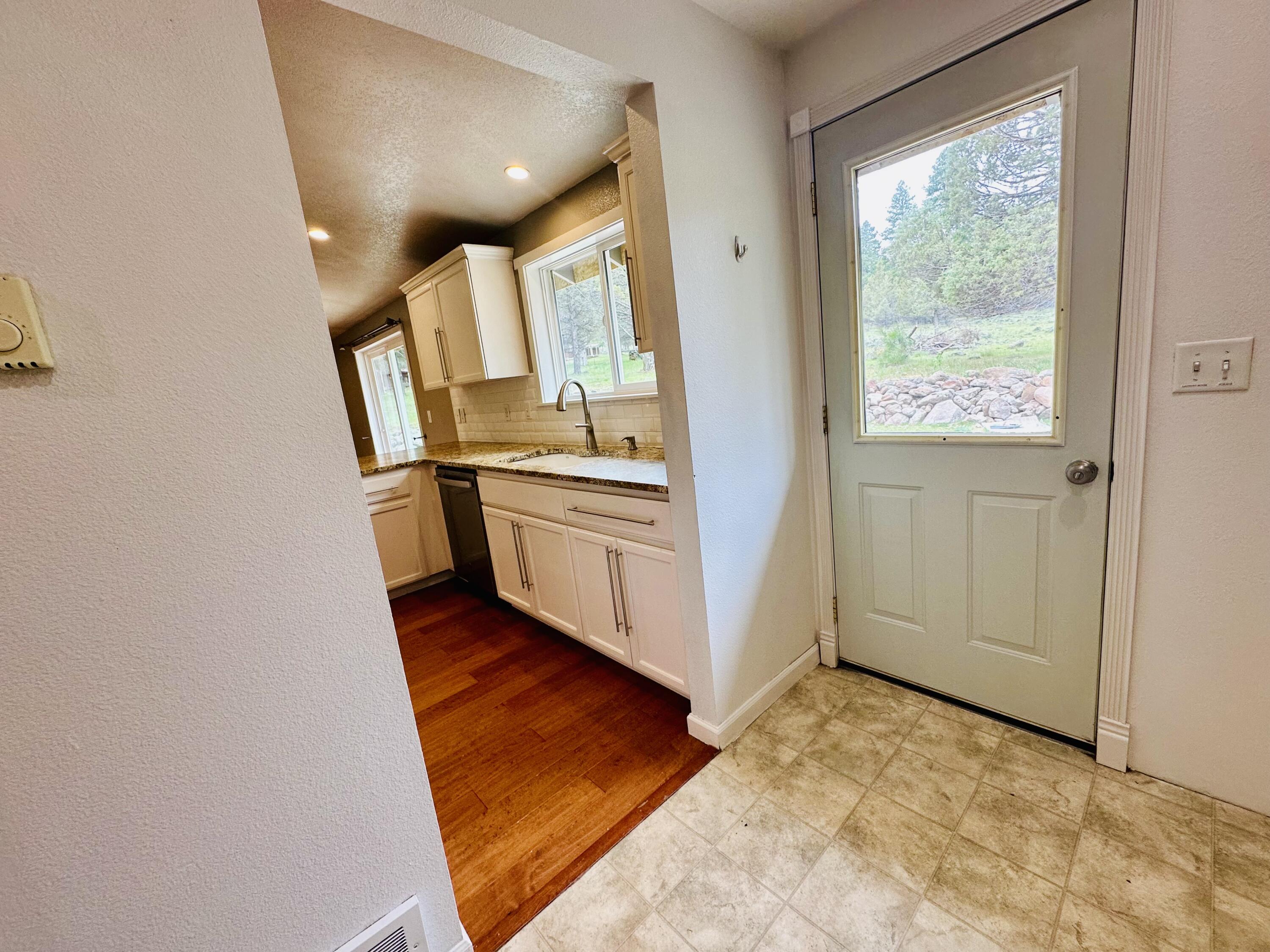 16524 Fieldcrest Road Klamath Falls, OR 97603 - Photo 26 of 58 a view of a kitchen cabinets and a wooden floor