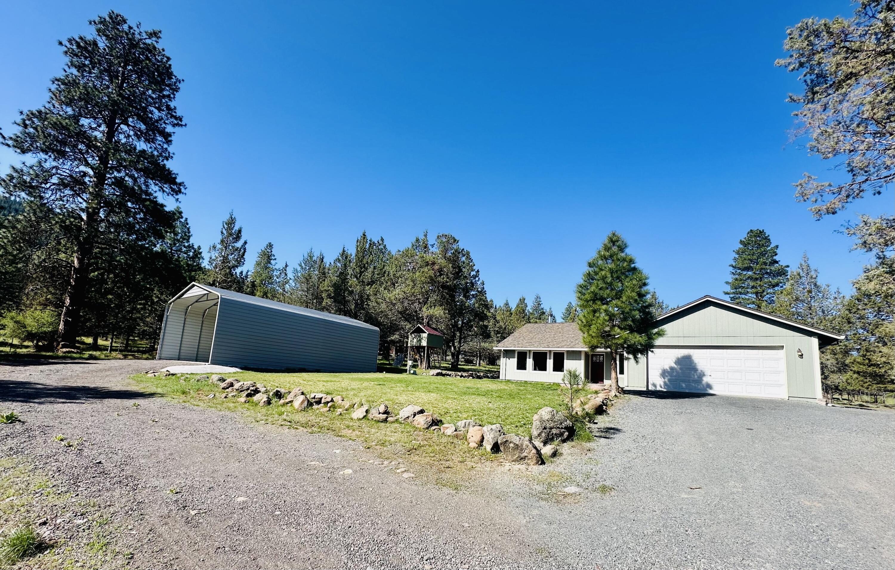 16524 Fieldcrest Road Klamath Falls, OR 97603 - Photo 54 of 58 a view of a house with yard and sitting area