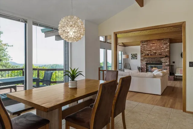 a view of a dining room with furniture wooden floor and chandelier