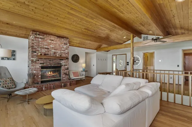 a large bedroom with a large bed and a fireplace