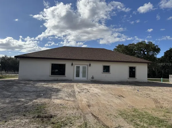 a house with trees in the background