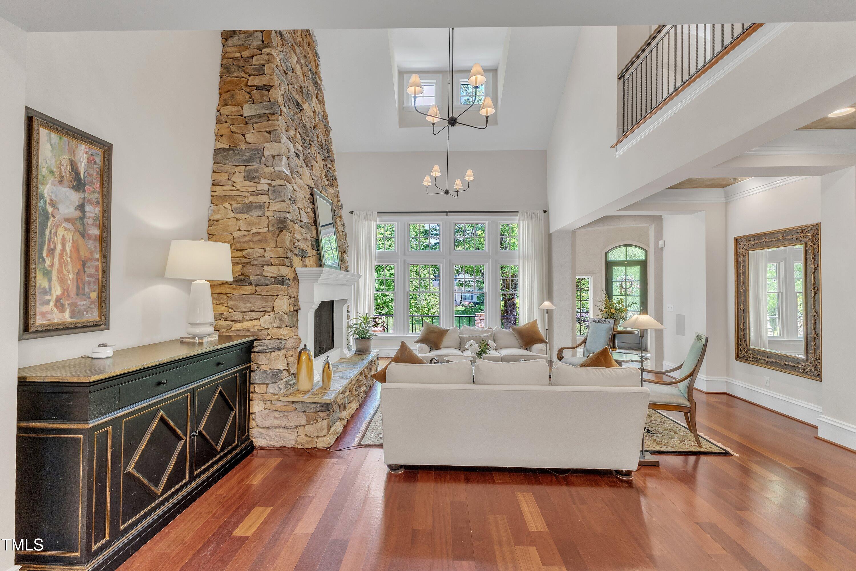 2117 Buckingham Road Raleigh, NC 27607 - Photo 7 of 82 a living room with fireplace furniture and a wooden floor