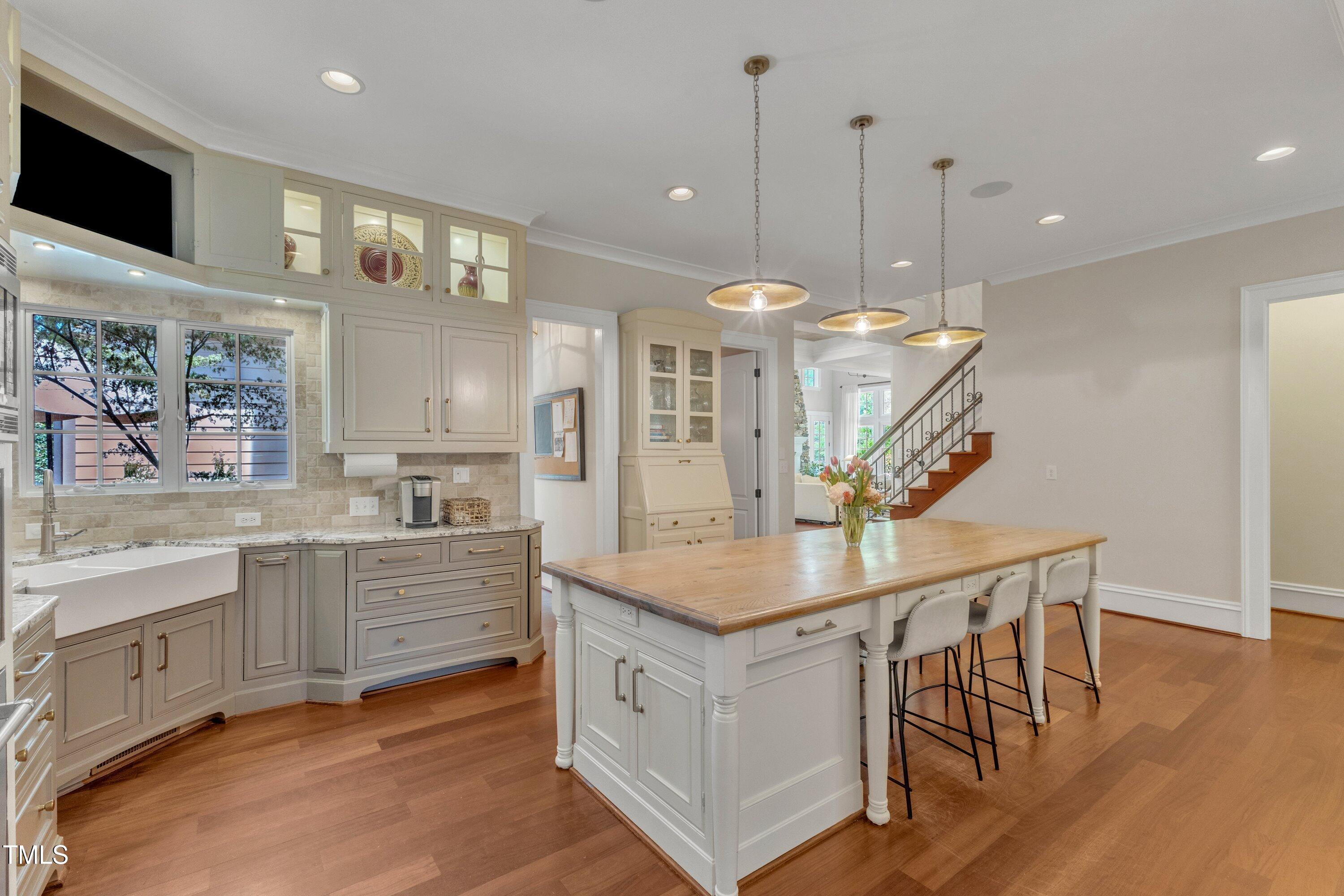 2117 Buckingham Road Raleigh, NC 27607 - Photo 14 of 82 a kitchen with stainless steel appliances granite countertop a kitchen island a stove and a sink