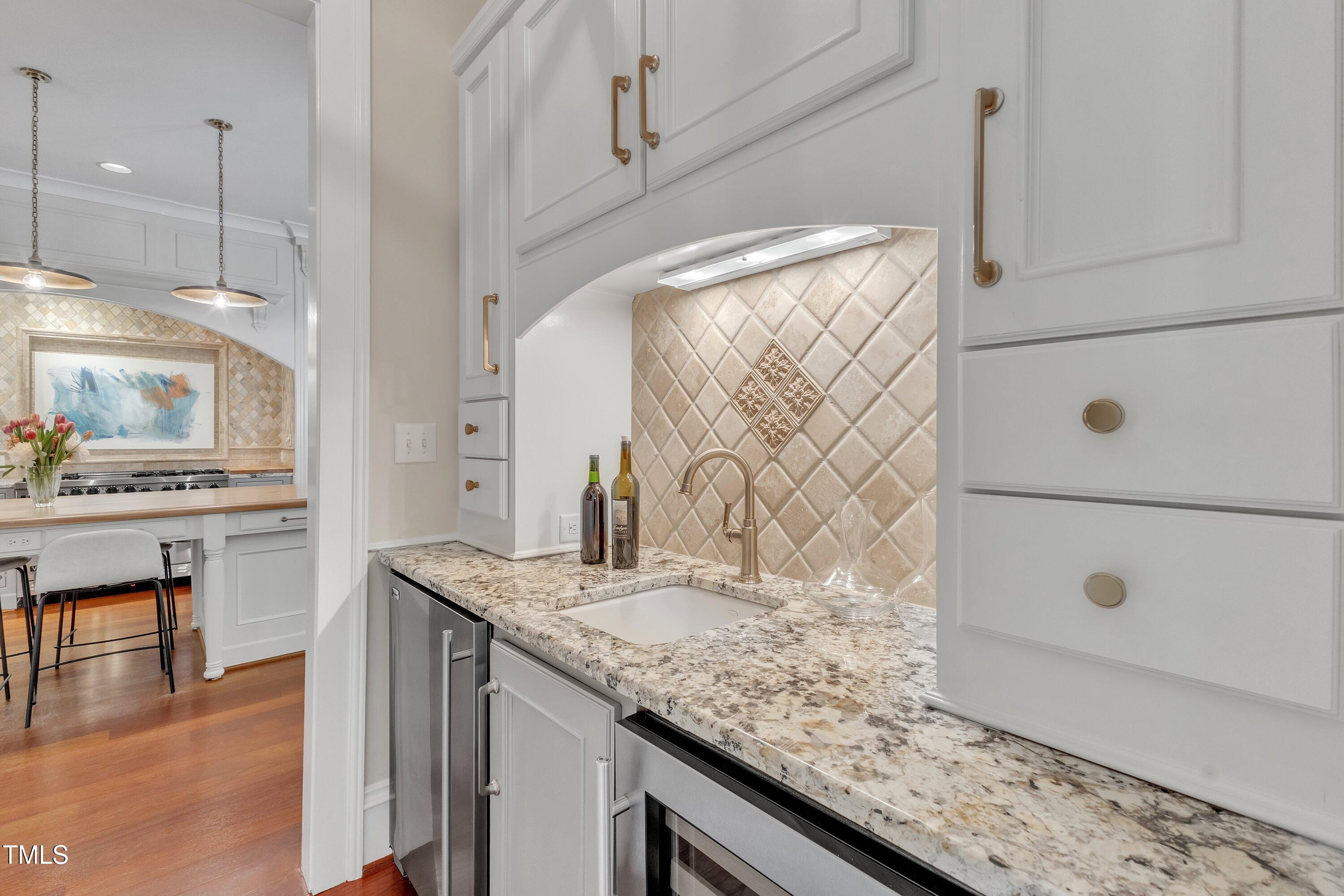 2117 Buckingham Road Raleigh, NC 27607 - Photo 19 of 82 a bathroom with a granite countertop sink and a mirror