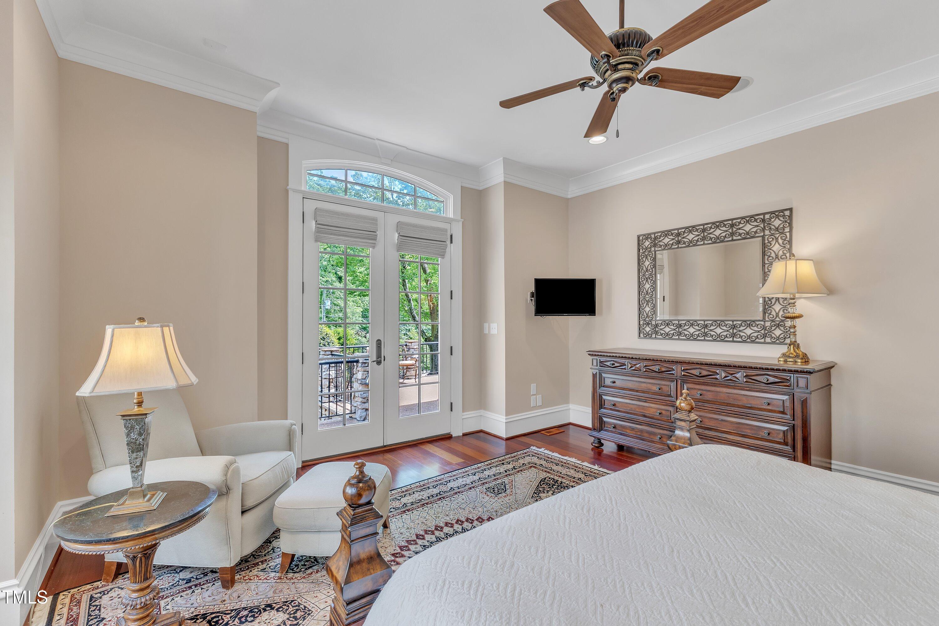 2117 Buckingham Road Raleigh, NC 27607 - Photo 24 of 82 a bedroom with a bed and a flat tv screen on dresser
