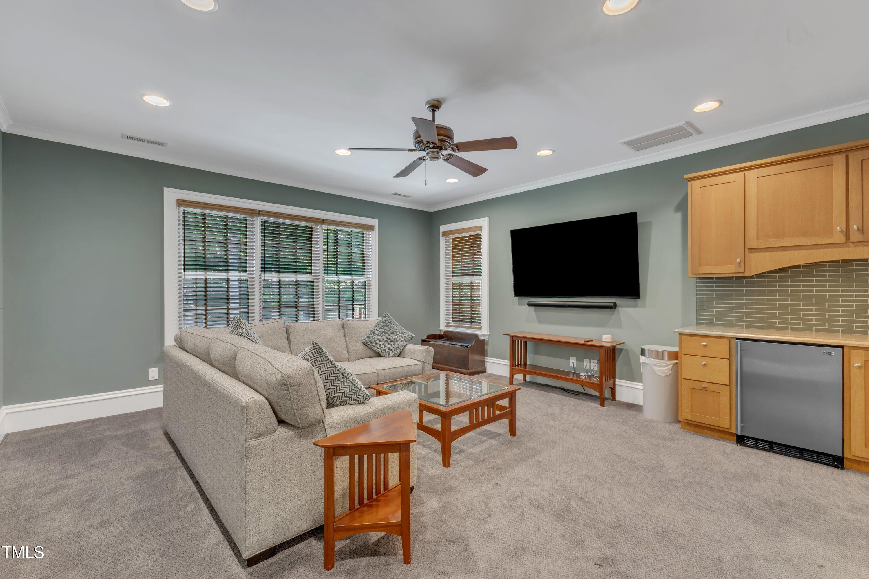 2117 Buckingham Road Raleigh, NC 27607 - Photo 41 of 82 a living room with furniture and a flat screen tv