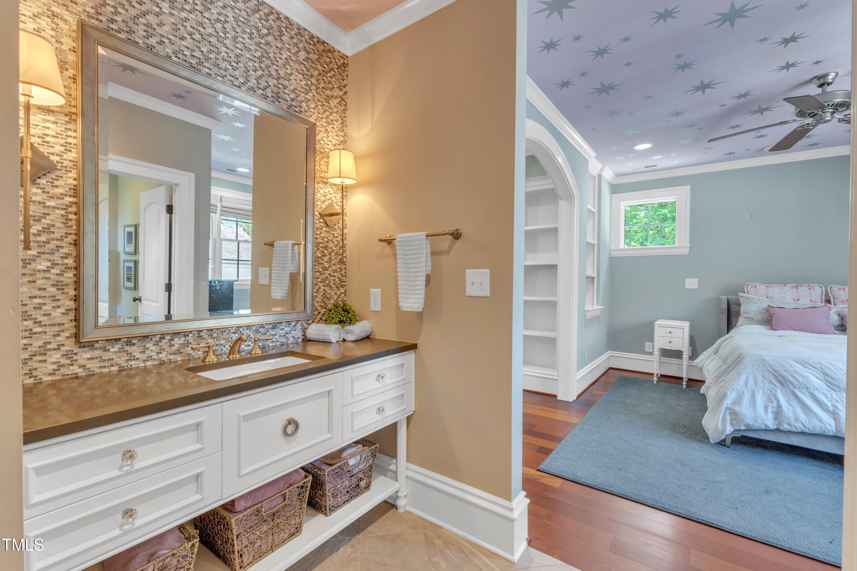 2117 Buckingham Road Raleigh, NC 27607 - Photo 51 of 82 a en suite bathroom with a granite countertop tub and a large mirror