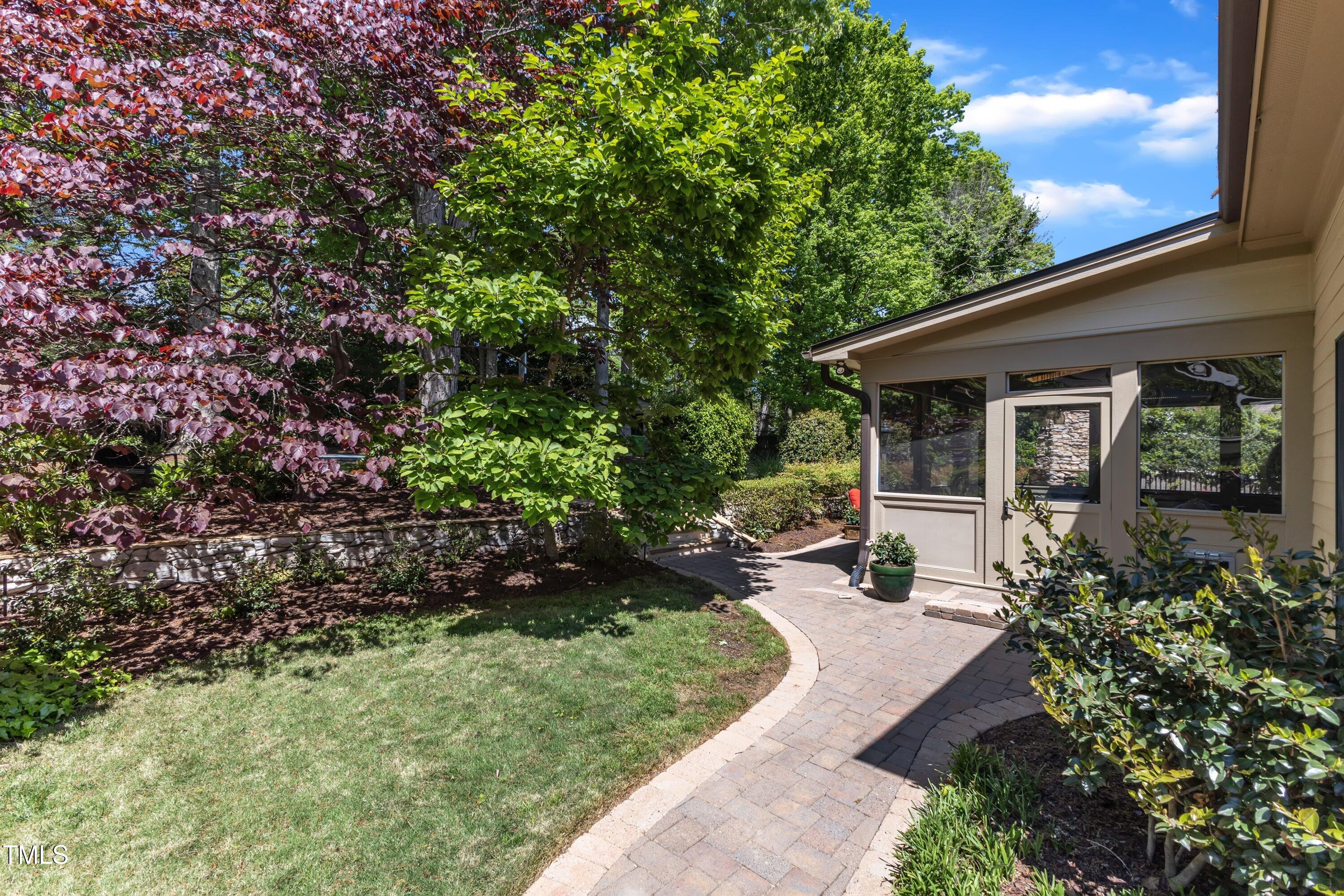 2117 Buckingham Road Raleigh, NC 27607 - Photo 69 of 82 a front view of a house with a yard and shrubs