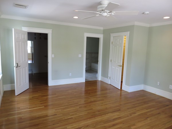 46 Harris Road Newton, MA 02465 - Photo 12 of 28 a view of an empty room with wooden floor and a ceiling fan