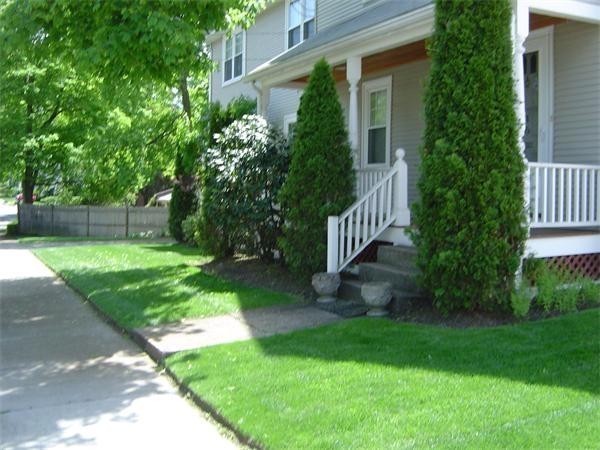 46 Harris Road Newton, MA 02465 - Photo 23 of 28 a view of a house with a yard and plants